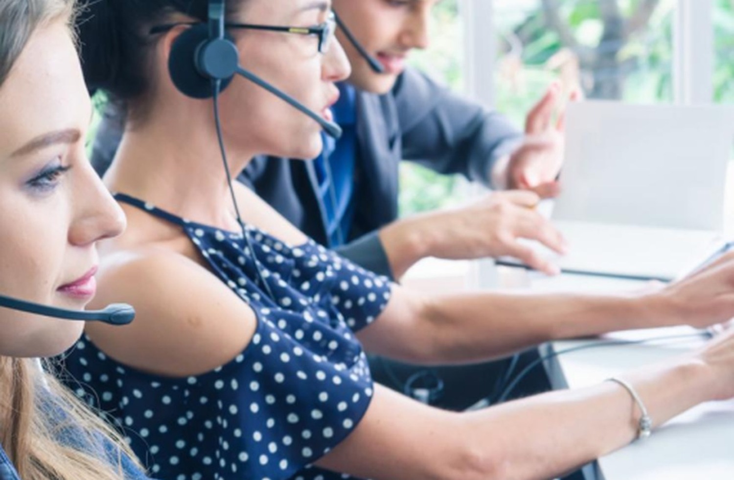Call center agents on headsets